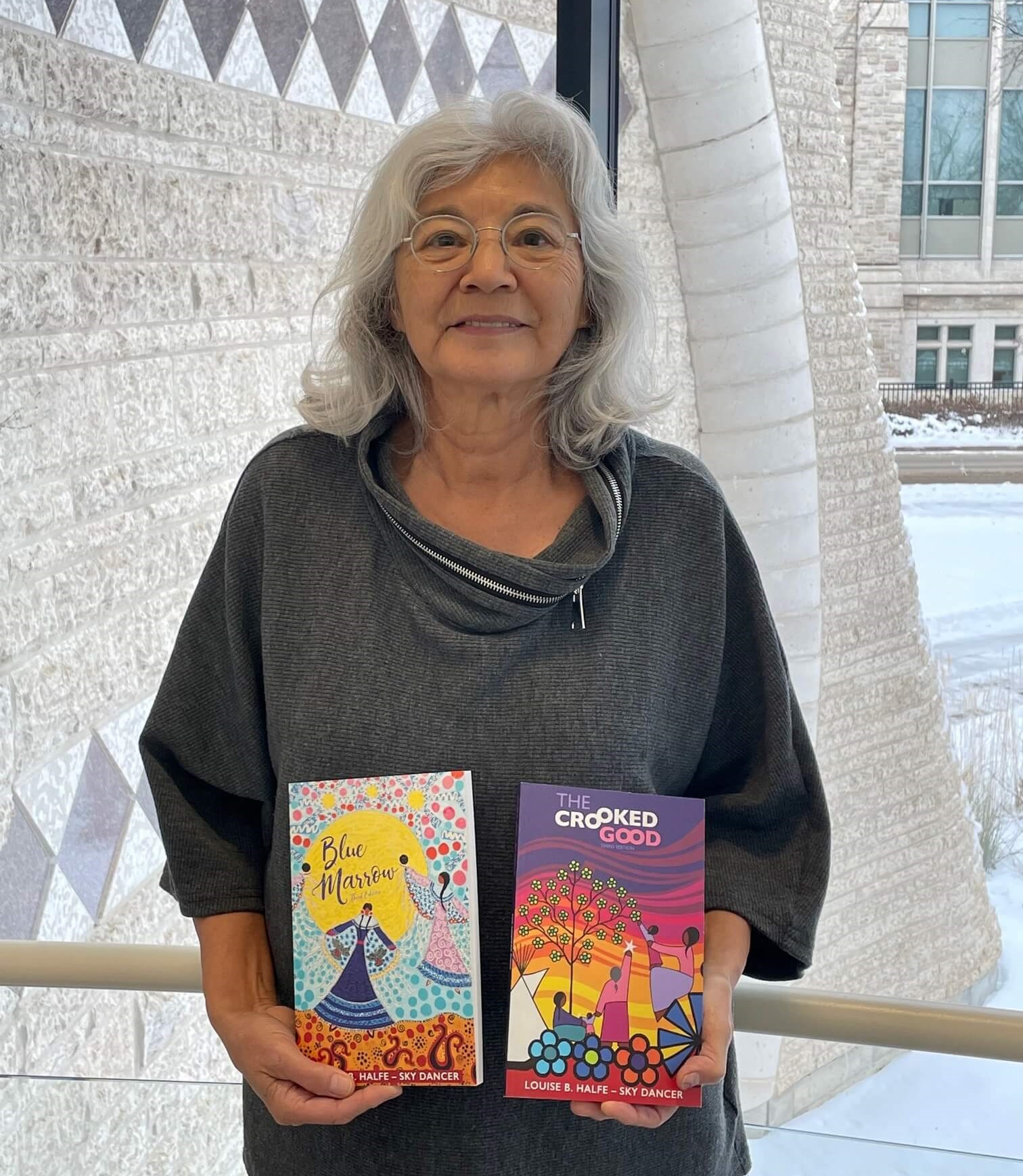 Sky Dancer, poet Louise B. Halfe, with her two new Kegedonce Press editions of Blue Marrow and The Crooked Good.
